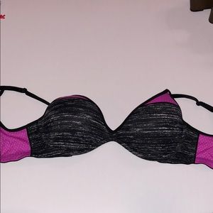 A 32 D dark grey and pink bra.